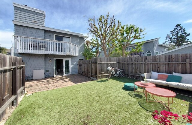 2512 Santa Ana Ave Unit 9, Costa Mesa, CA 92627 - rear view of house with a balcony and a patio
