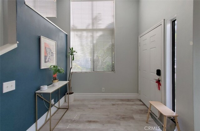 2512 Santa Ana Ave Unit 9, Costa Mesa, CA 92627 - entryway featuring baseboards and wood finished floors