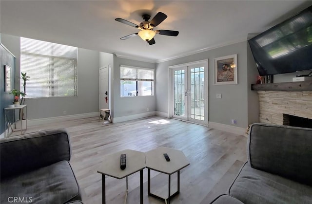 2512 Santa Ana Ave Unit 9, Costa Mesa, CA 92627 - living area with ceiling fan, baseboards, light wood-style flooring, ornamental molding, and a fireplace