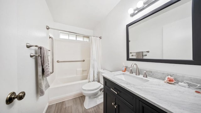bathroom featuring shower / bath combo, wood finished floors, vanity, and toilet