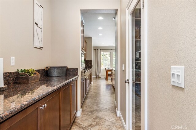 34595 Collier Falls Ct, Temecula, CA 92592 - corridor with light tile patterned floors, recessed lighting, and a textured wall