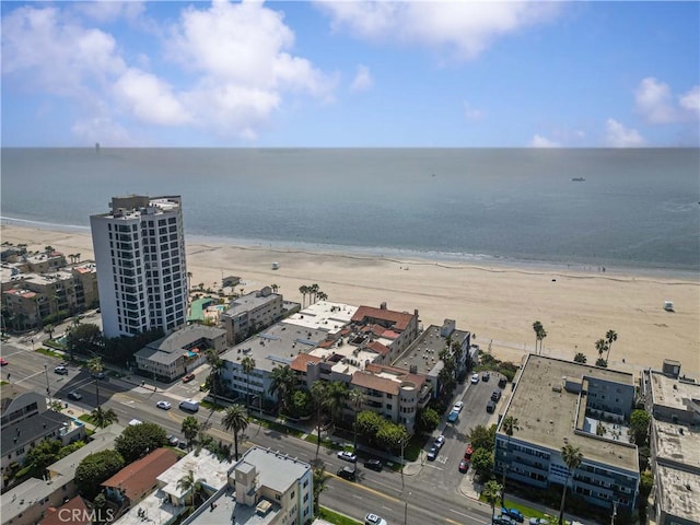 aerial view with a water view and a view of the beach