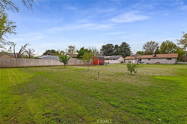 295 Chestnut Ave, Red Bluff, CA 96080 - view of yard with an outdoor structure, a storage unit, and fence