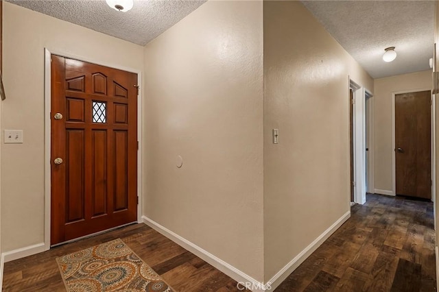 295 Chestnut Ave, Red Bluff, CA 96080 - foyer featuring a textured ceiling and dark wood-style floors