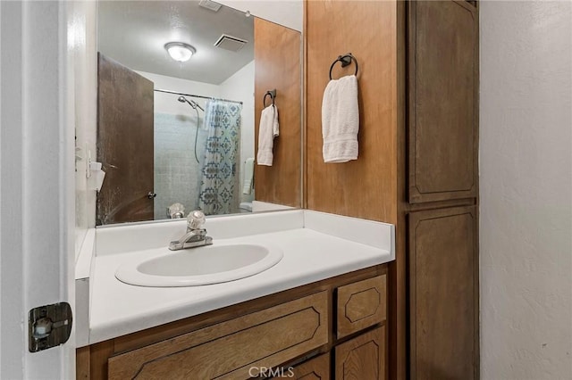 295 Chestnut Ave, Red Bluff, CA 96080 - full bath with visible vents, a textured wall, vanity, and a shower with shower curtain