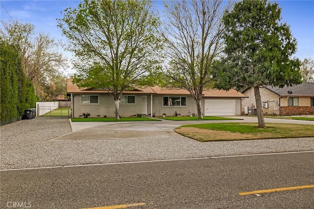 295 Chestnut Ave, Red Bluff, CA 96080 - ranch-style house with stucco siding, a gate, fence, and curved driveway