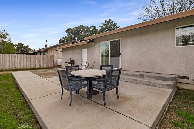 295 Chestnut Ave, Red Bluff, CA 96080 - view of patio with outdoor dining area and fence