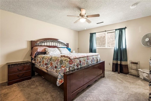 295 Chestnut Ave, Red Bluff, CA 96080 - bedroom with a textured ceiling, a ceiling fan, visible vents, and carpet