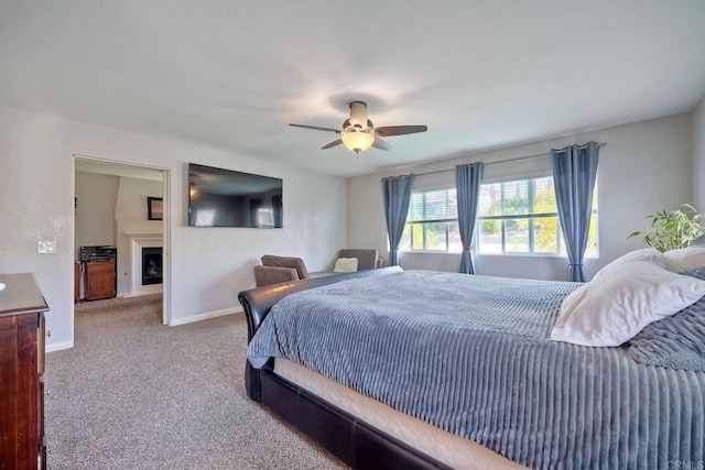 1140 Parkview Dr, Oceanside, CA 92057 - carpeted bedroom featuring baseboards, ceiling fan, and a fireplace