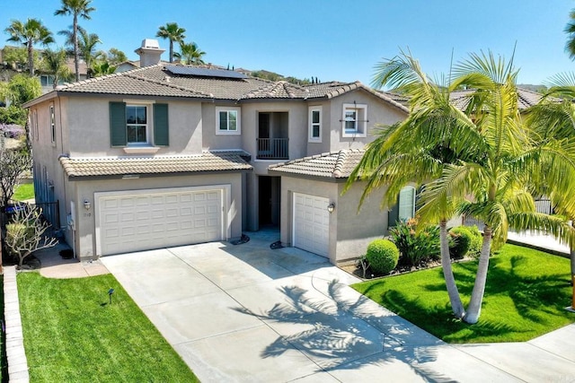 1140 Parkview Dr, Oceanside, CA 92057 - mediterranean / spanish-style home with an attached garage, stucco siding, solar panels, a tile roof, and concrete driveway