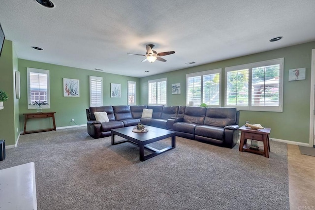 1140 Parkview Dr, Oceanside, CA 92057 - carpeted living area with ceiling fan, baseboards, and a textured ceiling