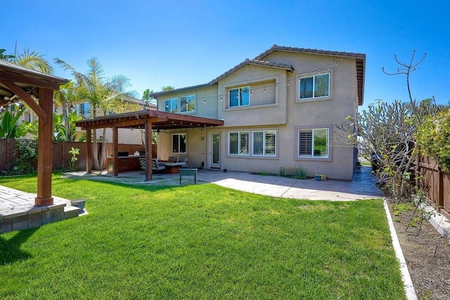 1140 Parkview Dr, Oceanside, CA 92057 - rear view of house with stucco siding, a patio, and outdoor lounge area