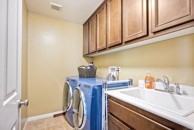 1140 Parkview Dr, Oceanside, CA 92057 - washroom featuring independent washer and dryer, cabinet space, baseboards, and light tile patterned flooring
