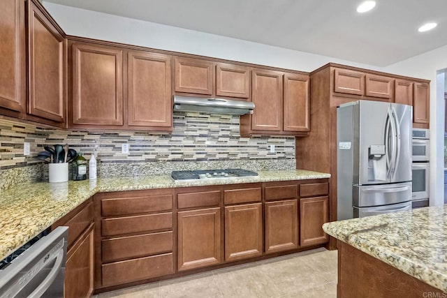 1140 Parkview Dr, Oceanside, CA 92057 - kitchen featuring appliances with stainless steel finishes, under cabinet range hood, backsplash, light stone counters, and recessed lighting