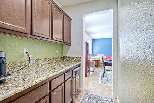 1140 Parkview Dr, Oceanside, CA 92057 - bar with beverage cooler, light tile patterned floors, and a textured wall