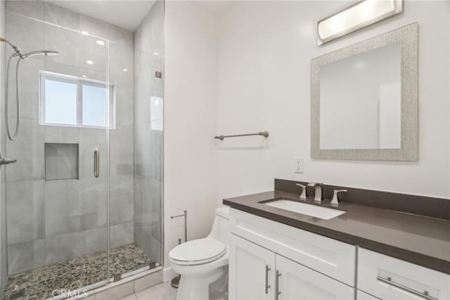 full bath with a stall shower, toilet, and vanity