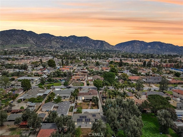 birds eye view of property with a mountain view and a residential view