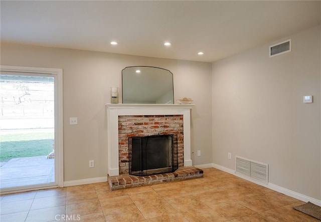 unfurnished living room featuring a fireplace, recessed lighting, visible vents, and tile patterned floors