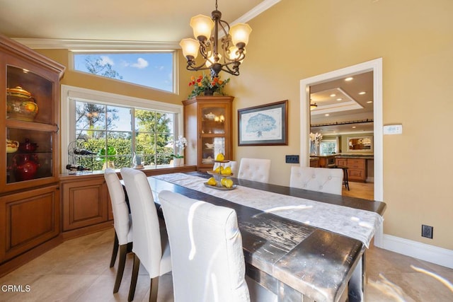 22671 Cheryl Way, Lake Forest, CA 92630 - dining room featuring crown molding, a chandelier, a high ceiling, and light tile patterned floors