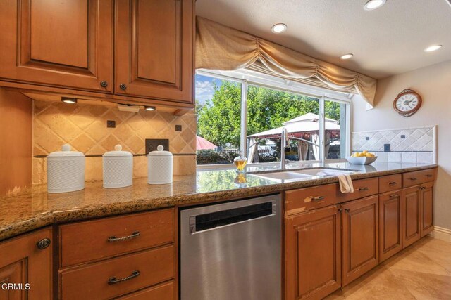 22671 Cheryl Way, Lake Forest, CA 92630 - kitchen featuring stainless steel dishwasher, brown cabinets, backsplash, stone counters, and recessed lighting