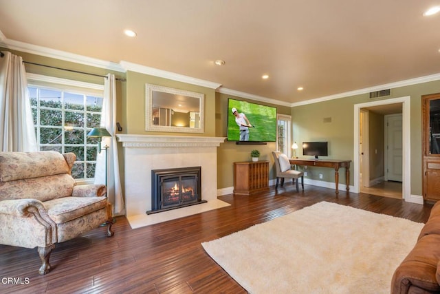 22671 Cheryl Way, Lake Forest, CA 92630 - living area with healthy amount of natural light, dark wood finished floors, a glass covered fireplace, crown molding, and recessed lighting