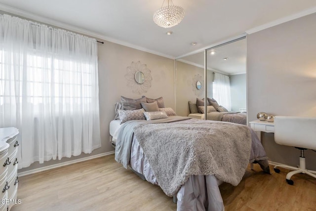 22671 Cheryl Way, Lake Forest, CA 92630 - bedroom featuring ornamental molding, light wood-style floors, and a closet