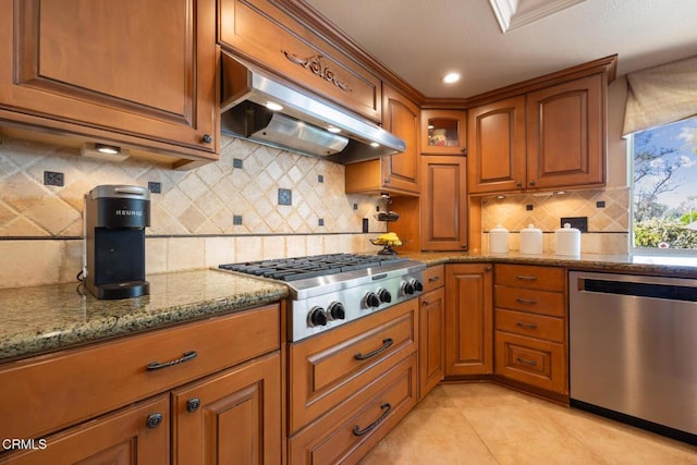 22671 Cheryl Way, Lake Forest, CA 92630 - kitchen with stainless steel appliances, extractor fan, brown cabinetry, and light stone counters