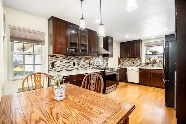 16372 Hollywood Ln, Huntington Beach, CA 92649 - kitchen with light countertops, freestanding refrigerator, dishwasher, stainless steel range with gas cooktop, and dark brown cabinets