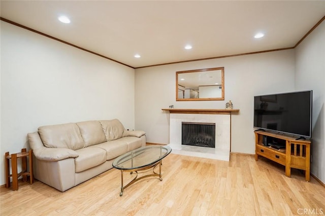 16372 Hollywood Ln, Huntington Beach, CA 92649 - living area featuring a high end fireplace, recessed lighting, crown molding, and wood finished floors