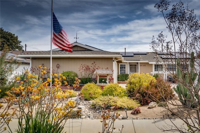 16372 Hollywood Ln, Huntington Beach, CA 92649 - view of front of property featuring roof mounted solar panels