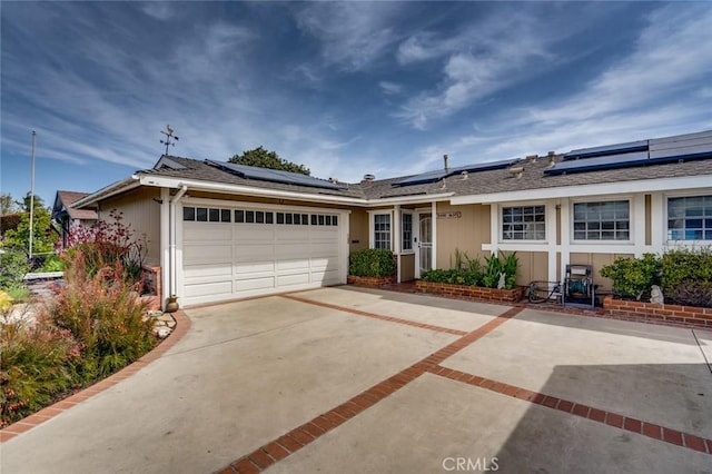 16372 Hollywood Ln, Huntington Beach, CA 92649 - ranch-style home with driveway, a garage, and roof mounted solar panels