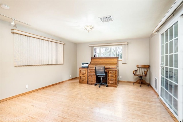 16372 Hollywood Ln, Huntington Beach, CA 92649 - home office with baseboards, visible vents, light wood-style flooring, and rail lighting