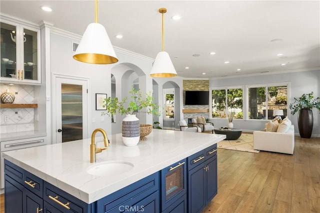 2107 Lemon Heights Dr, Santa Ana, CA 92705 - kitchen with a sink, open floor plan, tasteful backsplash, and blue cabinets