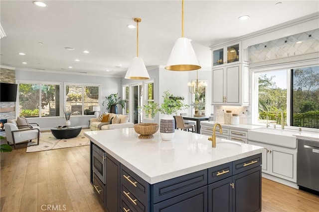 2107 Lemon Heights Dr, Santa Ana, CA 92705 - kitchen featuring white cabinets, open floor plan, a sink, and appliances with stainless steel finishes