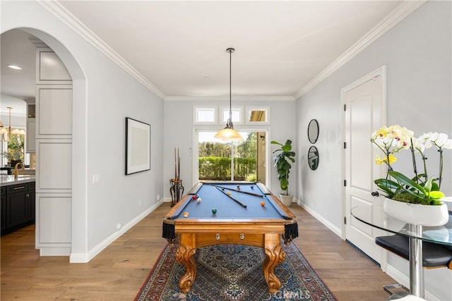 2107 Lemon Heights Dr, Santa Ana, CA 92705 - playroom featuring light wood-style flooring, arched walkways, a sink, and plenty of natural light