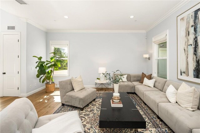 2107 Lemon Heights Dr, Santa Ana, CA 92705 - living room featuring crown molding, wood finished floors, baseboards, and visible vents