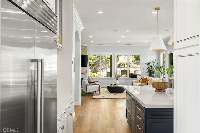 2107 Lemon Heights Dr, Santa Ana, CA 92705 - kitchen featuring built in appliances, open floor plan, light wood-style floors, and recessed lighting