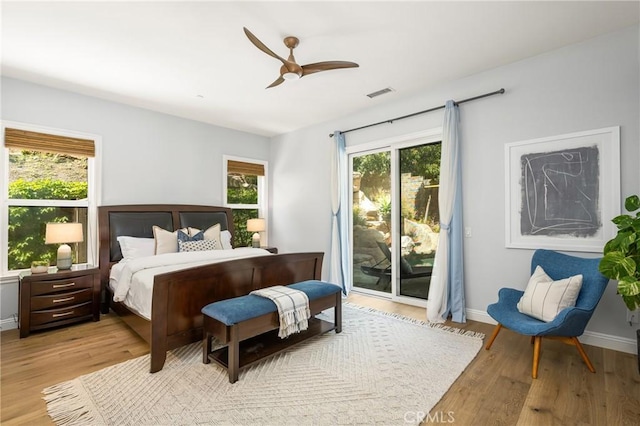 2107 Lemon Heights Dr, Santa Ana, CA 92705 - bedroom featuring access to outside, wood finished floors, ceiling fan, and visible vents