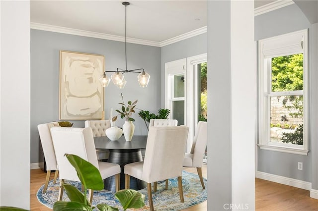 2107 Lemon Heights Dr, Santa Ana, CA 92705 - dining area with crown molding, baseboards, a notable chandelier, and light wood-style floors
