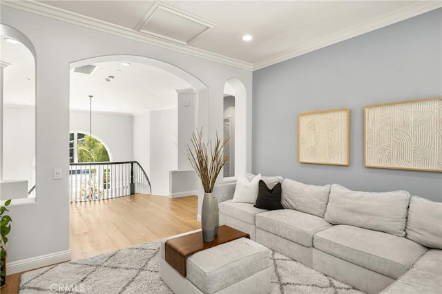 2107 Lemon Heights Dr, Santa Ana, CA 92705 - living room with recessed lighting, wood finished floors, ornamental molding, arched walkways, and baseboards