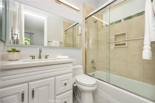 2107 Lemon Heights Dr, Santa Ana, CA 92705 - bathroom with toilet, vanity, and bath / shower combo with glass door