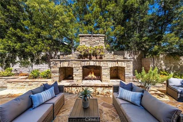 2107 Lemon Heights Dr, Santa Ana, CA 92705 - view of patio with an outdoor living space with a fireplace