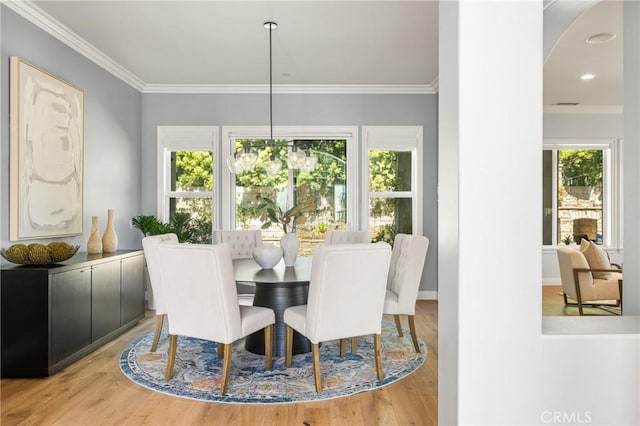 2107 Lemon Heights Dr, Santa Ana, CA 92705 - dining area featuring wood finished floors, arched walkways, and crown molding