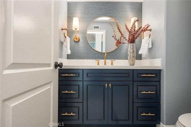 2107 Lemon Heights Dr, Santa Ana, CA 92705 - half bath with toilet, vanity, visible vents, and baseboards