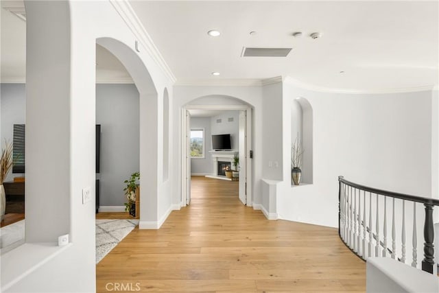 2107 Lemon Heights Dr, Santa Ana, CA 92705 - hall featuring arched walkways, baseboards, recessed lighting, light wood-style floors, and ornamental molding
