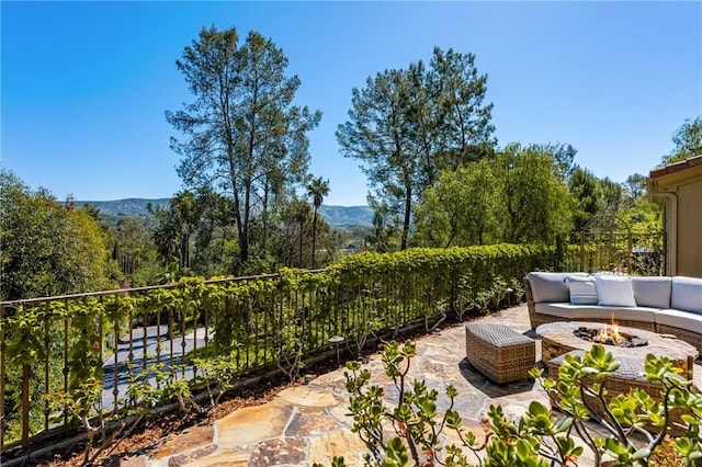 2107 Lemon Heights Dr, Santa Ana, CA 92705 - view of patio / terrace featuring a fire pit, a mountain view, and fence