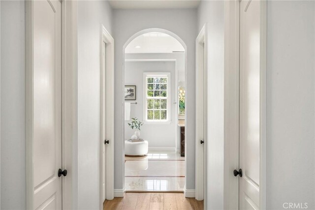 2107 Lemon Heights Dr, Santa Ana, CA 92705 - hallway with arched walkways and baseboards