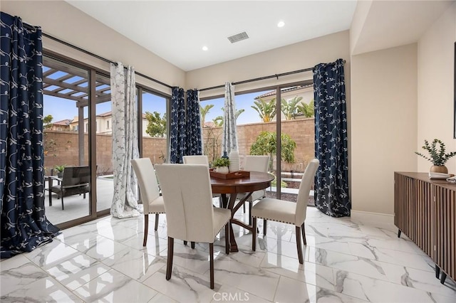 dining area featuring recessed lighting, visible vents, marble finish floor, and baseboards