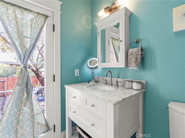 2155 Florence Ave, San Luis Obispo, CA 93401 - bathroom with vanity, toilet, and a textured wall
