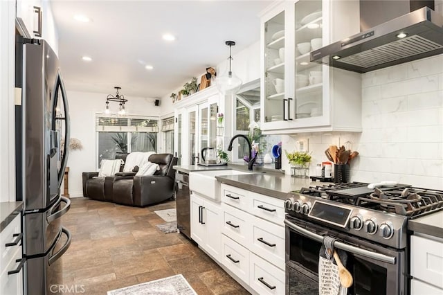 7612 Appleby, Huntington Beach, CA 92648 - kitchen featuring wall chimney range hood, dark countertops, a sink, and stainless steel appliances